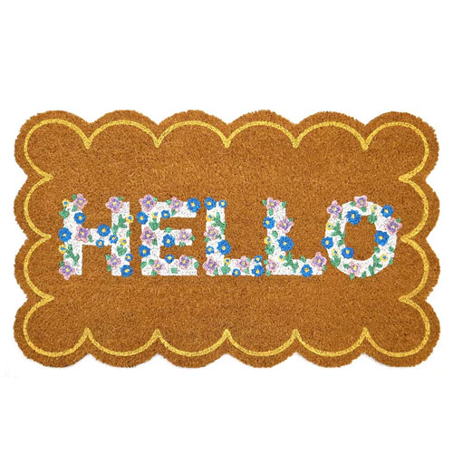 A rectangular doormat with scalloped edges, featuring the word \“HELLO\“ in colorful floral lettering against a coir-like brown background.
