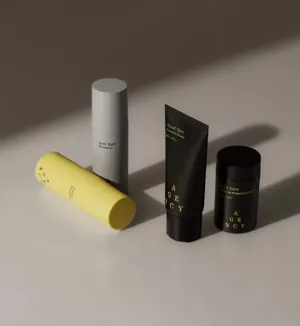 A set of skincare products including a dark spot formula, a cloud care oil cream, and a niacinamide whipped moisturizer, displayed in sleek black, grey, and yellow packaging.