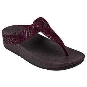 A maroon sandal with a sparkly T-strap design and a contoured dark brown footbed, featuring a small buckle detail.