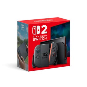 A Nintendo Switch 2 console packaging featuring the console, dock, and Joy-Con controllers in a red and black design.