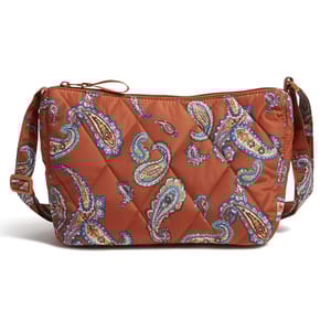 Quilted crossbody bag with an orange base and colorful paisley pattern, featuring an adjustable strap.