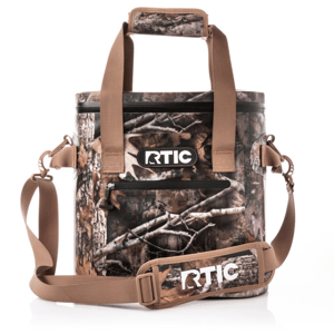 RTIC 20 Can Cooler Bag features a camouflage design with tan straps and a logo on the front. It includes a zippered front pocket, shoulder strap, and padded handles.