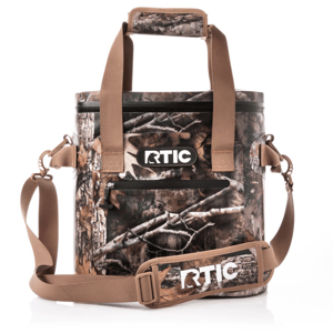 RTIC 20 Can Cooler Bag features a camouflage design with tan straps and a logo on the front. It includes a zippered front pocket, shoulder strap, and padded handles.