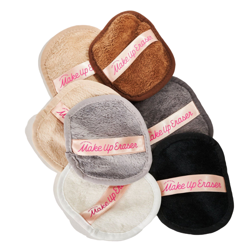 Various colored reusable makeup remover pads labeled \“Make Up Eraser,\“ featuring a plush texture for gentle cleansing.
