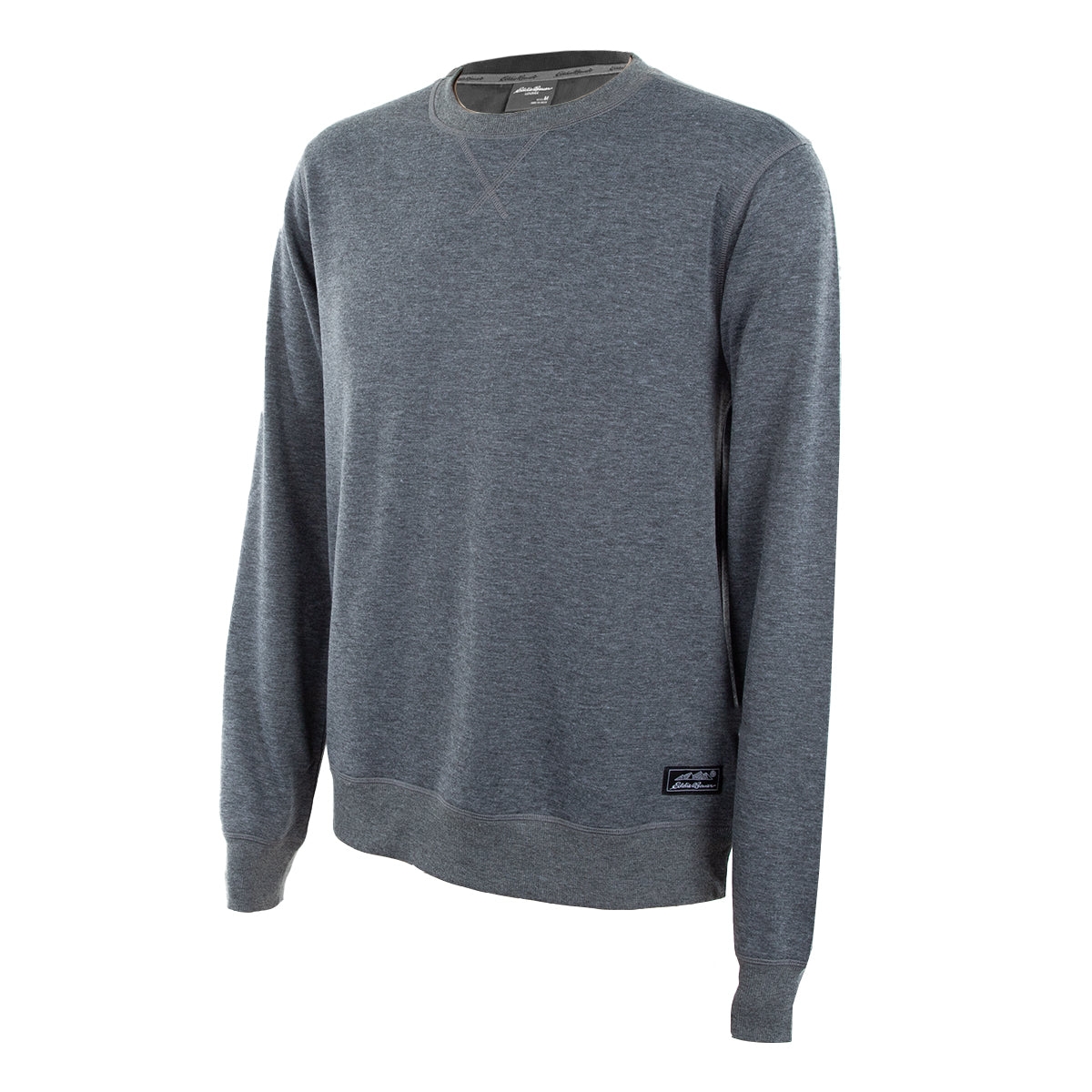 A gray Eddie Bauer crew sweater with long sleeves, featuring a small black label near the hem. The sweater is simple and casual with a V-stitch detail at the neckline.