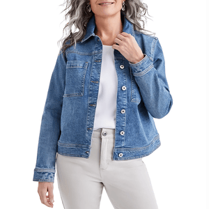 A relaxed-fit blue denim jacket with button-front closure, chest pockets, and long sleeves. It's paired with a white top and light-colored pants.