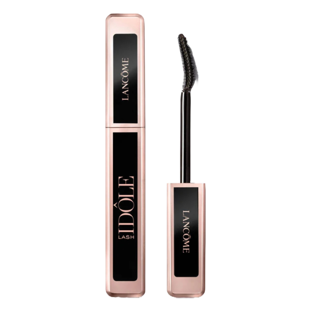 Lancôme Lash Idôle Mascara features a sleek black and rose gold design with a curved wand for lifting and volumizing lashes. The wand is shown separated from the tube, highlighting its unique shape.