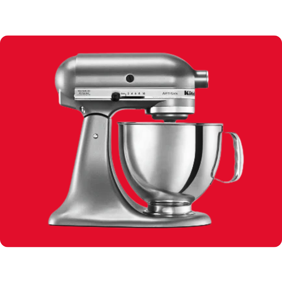 A silver stand mixer with a stainless steel mixing bowl against a red background.