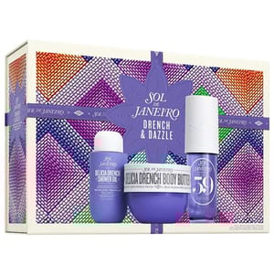 Sol de Janeiro Drench & Dazzle set includes Delicia Drench Shower Oil, Delicia Drench Body Butter, and a spray labeled \“68.\“ The packaging features vibrant purple and multicolored beadwork design.