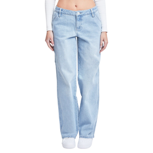 Light blue high-waisted straight-leg jeans paired with white sneakers, worn with a white long-sleeve crop top.
