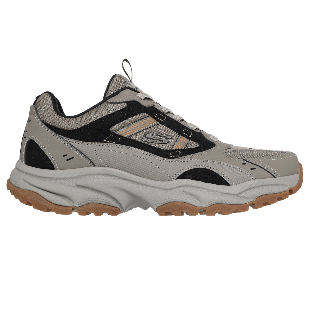 Gray and black athletic shoe with orange accents, featuring a rugged tread, mesh and synthetic upper, and a cushioned midsole for comfort.