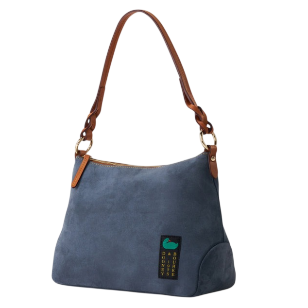 A blue suede shoulder bag with brown leather straps, featuring a zipper closure and a small logo patch at the front.