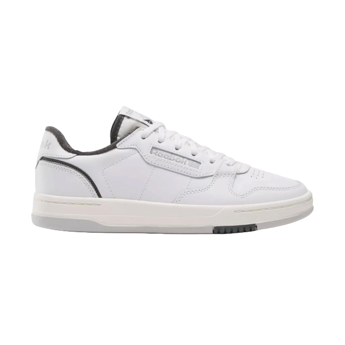 A white Reebok sneaker with black accents, featuring a low-top design, lace-up closure, and a textured sole.