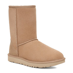 Tan sheepskin boot with a rubber sole.