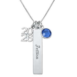 A silver necklace with three charms: a \“2026\“ numeral, a rectangular bar engraved with \“Jessica,\“ and a round blue gemstone.