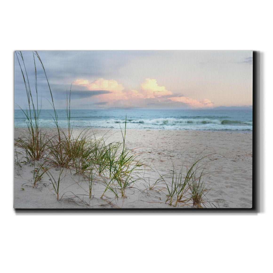 Canvas wall art depicting a serene beach scene with sand dunes and seagrass, highlighting a sunset over the ocean.