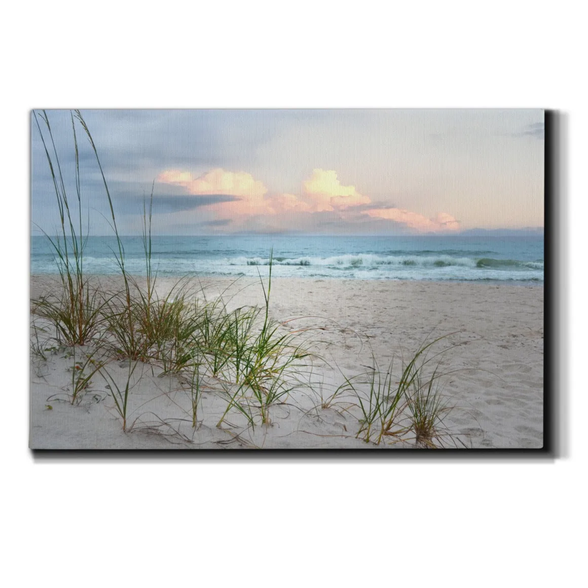Canvas wall art depicting a serene beach scene with sand dunes and seagrass, highlighting a sunset over the ocean.