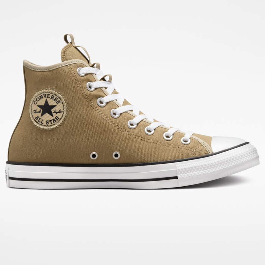 A single beige, high-top Converse Chuck Taylor All Star sneaker, viewed from the side.
