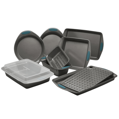 A set of non-stick bakeware includes round and square cake pans, a loaf pan, a covered rectangular cake pan, and a perforated baking pan, each with teal silicone grips.