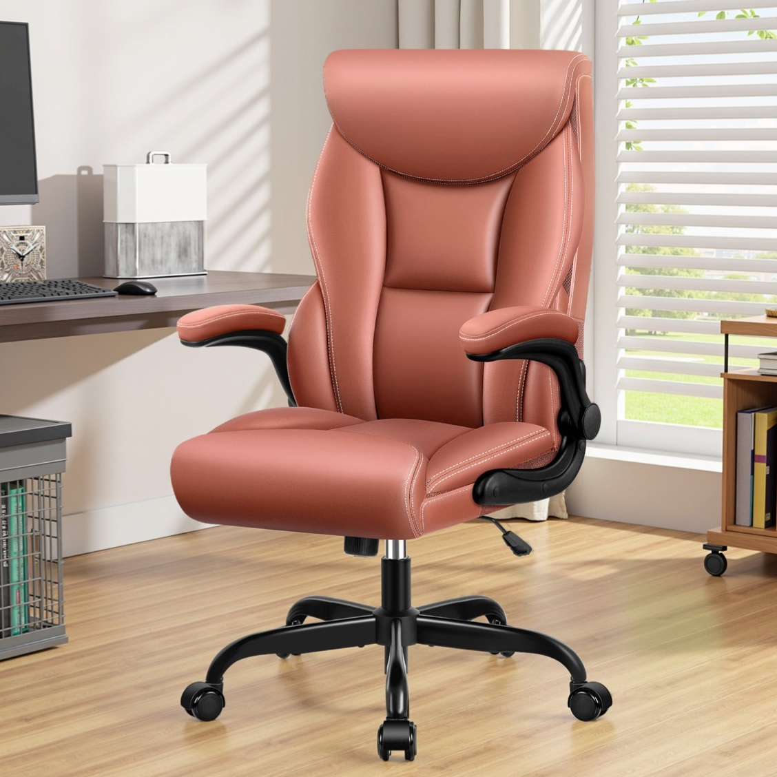 An ergonomic office chair with cushioned seat, high backrest, and adjustable armrests in a pinkish hue, placed in a home office setting with a wooden floor and desk.