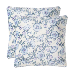 Two decorative pillows with a floral pattern in shades of blue and lavender on a white background.