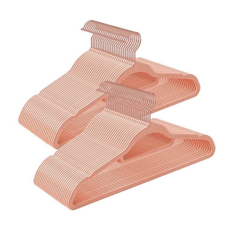 50pk of blush-colored velvet hangers with a slim, non-slip design, featuring metal hooks for hanging clothes.