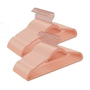 50pk of blush-colored velvet hangers with a slim, non-slip design, featuring metal hooks for hanging clothes.