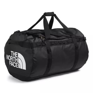 A black duffel bag from The North Face with durable straps and a zippered closure, featuring the brand's logo in white.