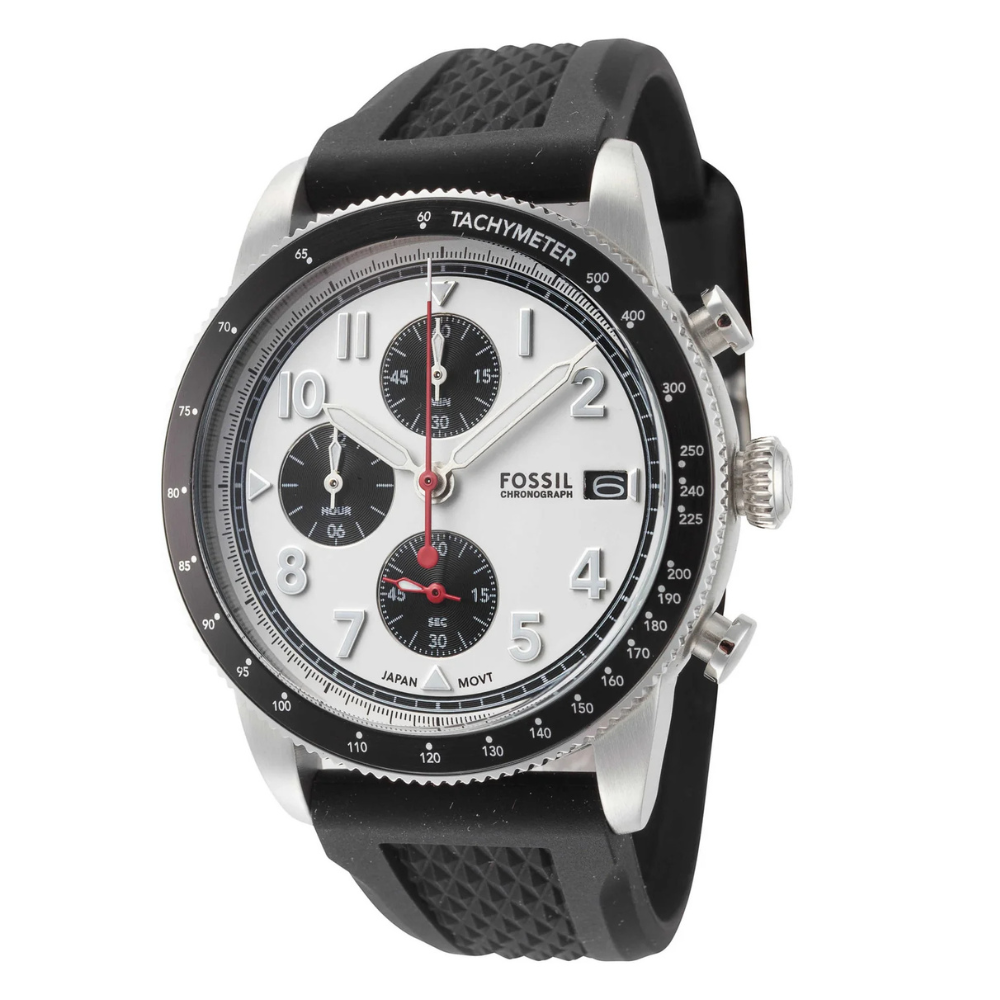 A Fossil chronograph watch with a silver-toned case, black tachymeter bezel, white dial, and black subdials, featuring large Arabic numerals and a black textured strap.