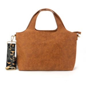 Brown tote bag featuring a 15-inch size with short top handles, accompanied by a detachable printed crossbody strap in a leopard pattern.