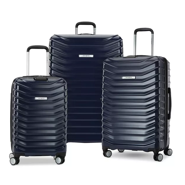 A set of three blue, hard-shell, rolling suitcases in different sizes.