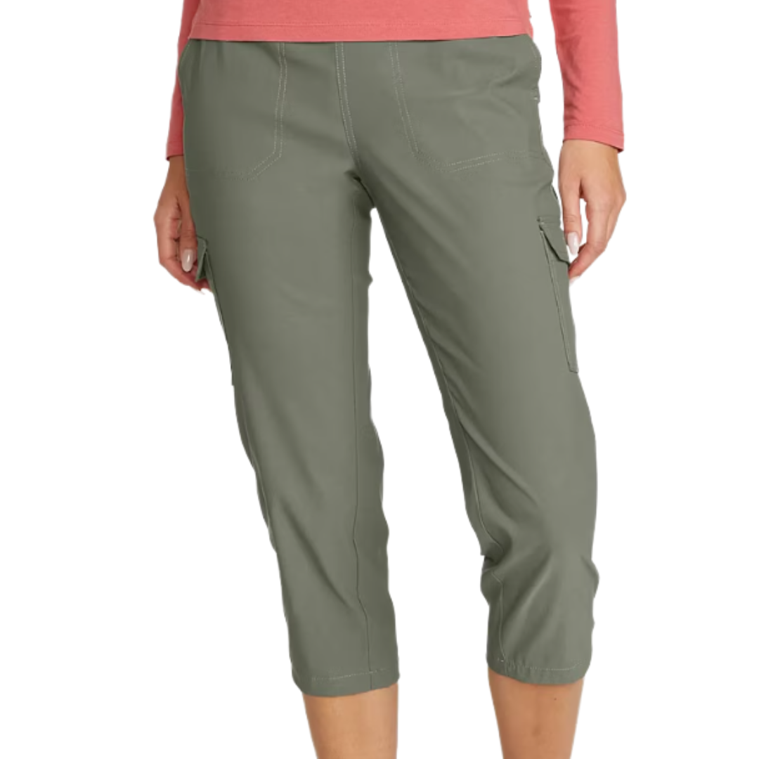 Woman wearing olive green capri cargo pants with a pink long-sleeve shirt. The pants feature side pockets and have a knee-length cut.