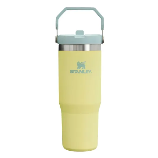 A yellow Stanley travel mug with a blue lid and handle, featuring the Stanley logo.