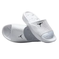 A pair of white slide sandals featuring a black logo, textured with a design reminiscent of elephant print.