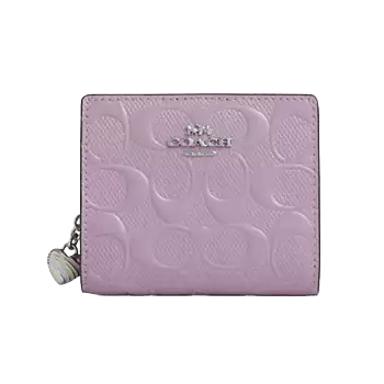 Pink Coach wallet with embossed signature pattern and silver logo, featuring a zipper pull with a decorative charm.
