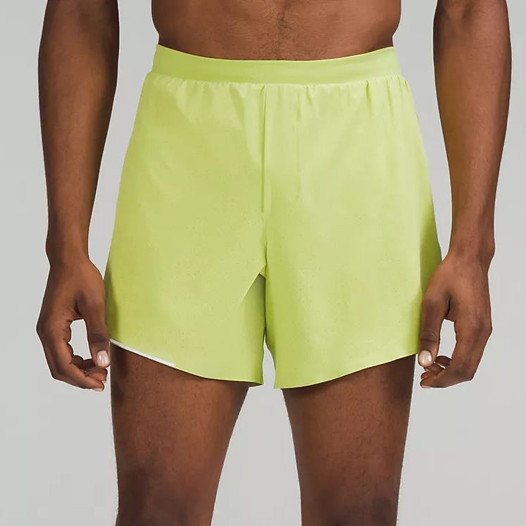 A person wearing bright yellow athletic shorts.