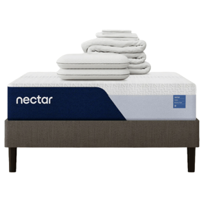Nectar mattress with blue and white cover, featuring memory foam. Includes two stacked pillows and folded bedding, all placed on a dark gray bed frame with four legs.