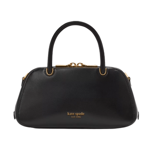 A black Kate Spade handbag with gold hardware and a structured silhouette, featuring two handles and the brand logo on the front.