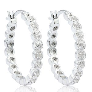 Elegant 1/4ct diamond hoop earrings with a circle design, featuring sparkling diamonds set in polished metal.