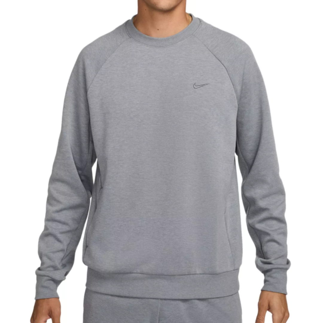 Gray sweatshirt with a small Nike logo on the chest, featuring long sleeves and a crew neck design.