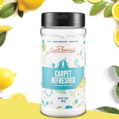 a jar of aunt fannie's carpet refresher in front of a white background featuring lemons