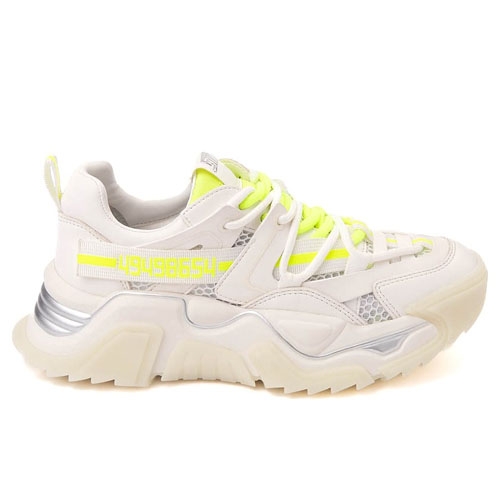 Steve Madden sneakers with a chunky sole, predominantly white with neon yellow accents, and intricate overlay designs.