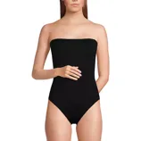 A strapless black one-piece swimsuit is shown, featuring a sleek and simple design.