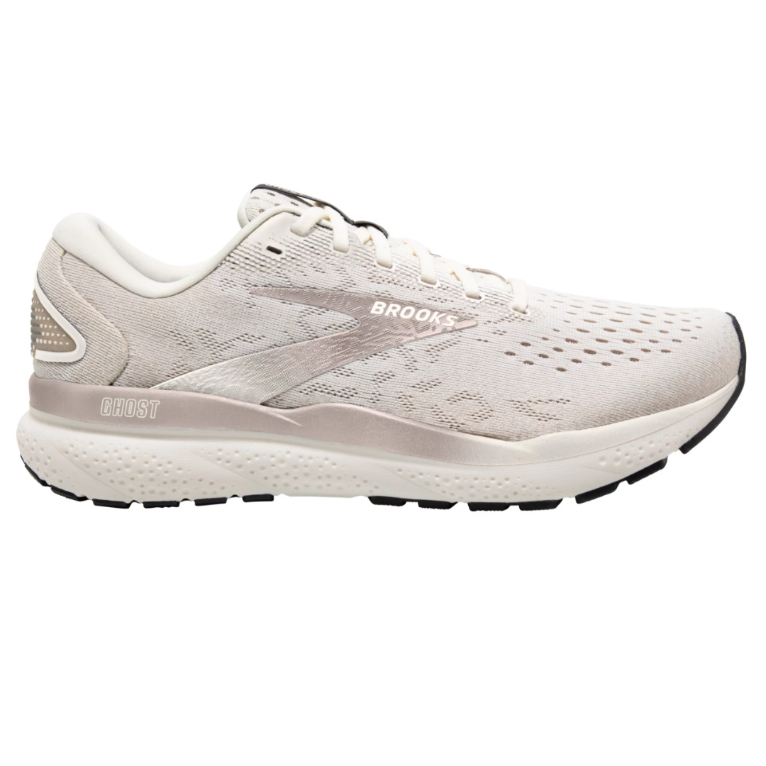 Brooks Ghost 16 Running Shoes feature a soft, neutral design with a light cream color, perforated breathable upper, cushioned midsole, and black rubber outsole for traction.