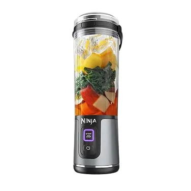 A Ninja brand portable blender with a clear blending cup filled with fruits and vegetables, featuring a power button and digital interface.
