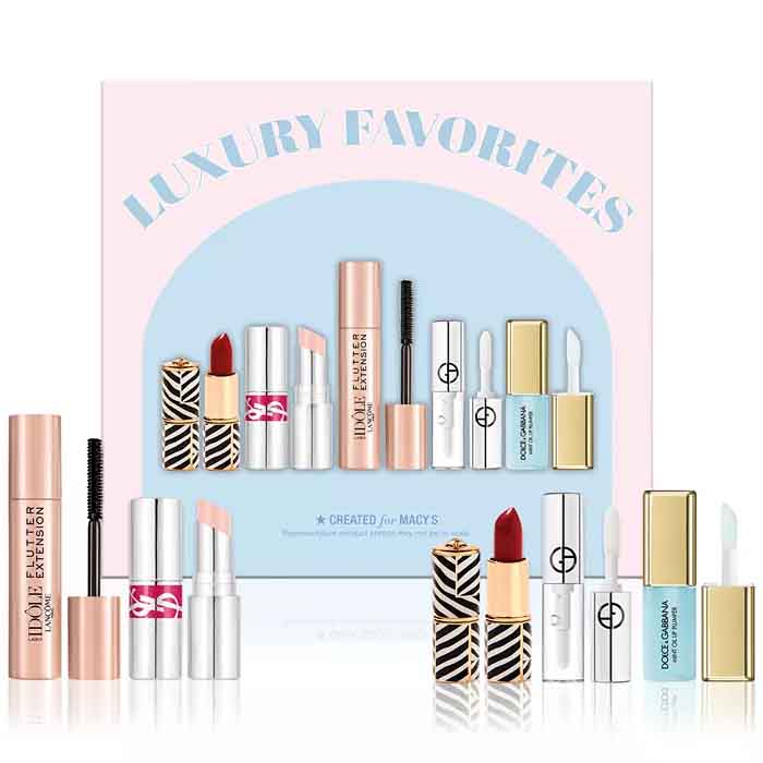 A \“Luxury Favorites\“ makeup set includes mascara labeled \“Flutter Extension,\“ red and light pink lipsticks, and three small lip glosses branded by well-known cosmetic brands, created for Macy's.