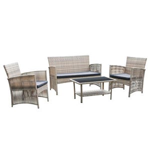 Woven wicker outdoor furniture set consisting of a sofa, two armchairs, and a coffee table with glass top, all finished in a neutral tone with blue cushions.