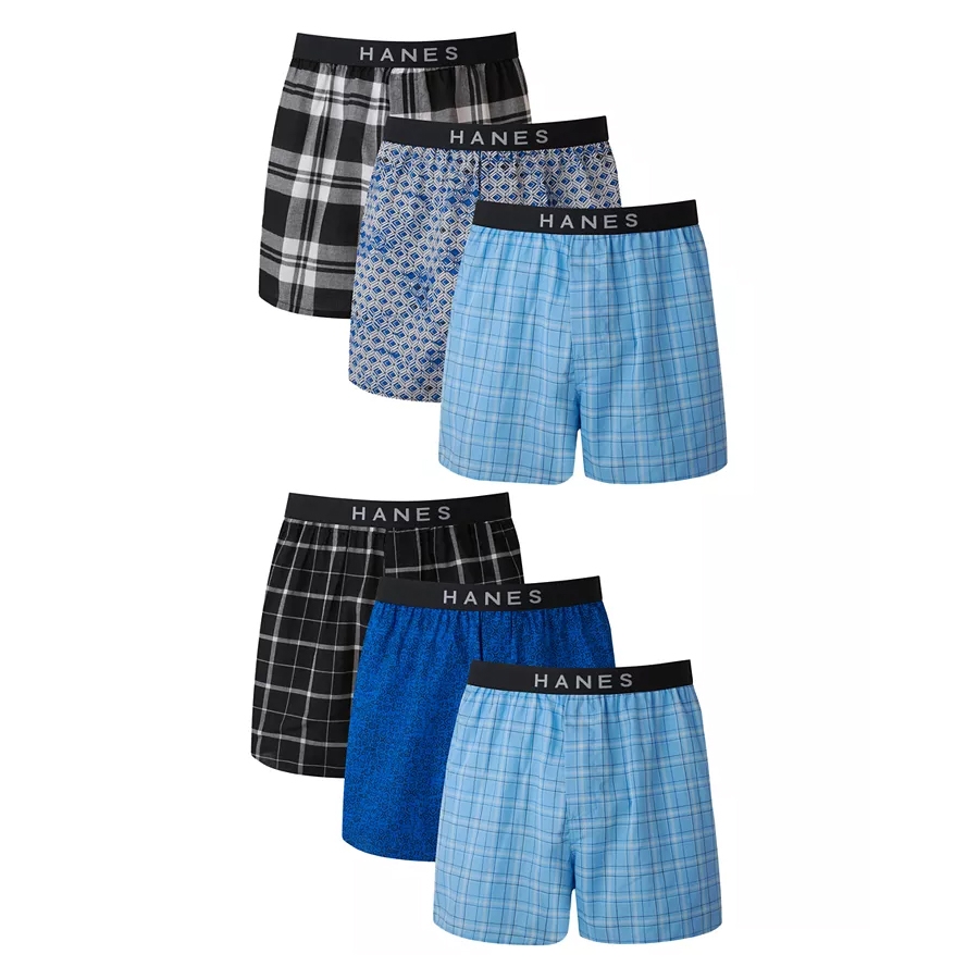 A pack of six Hanes men's boxers in various colors and patterns, featuring plaid, geometric, and solid designs, each with a black waistband.