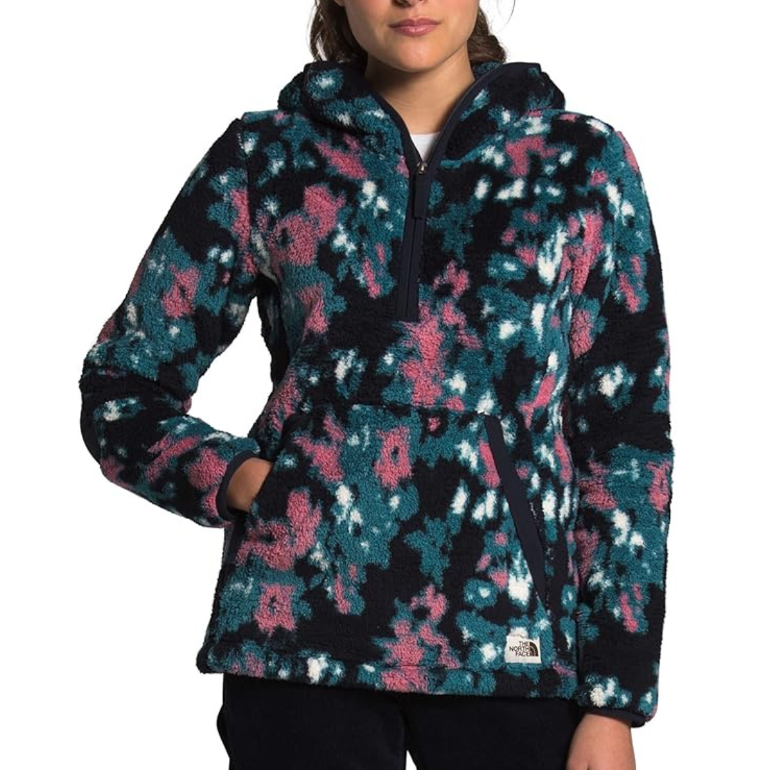 Multicolored fleece pullover with a half-zip front and a large front pocket, featuring a mix of teal, pink, and white patterns.