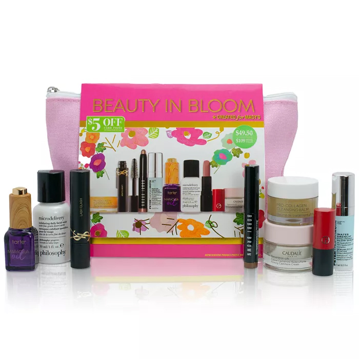 A variety of cosmetic items including makeup, skincare products, and a pink cosmetic bag.